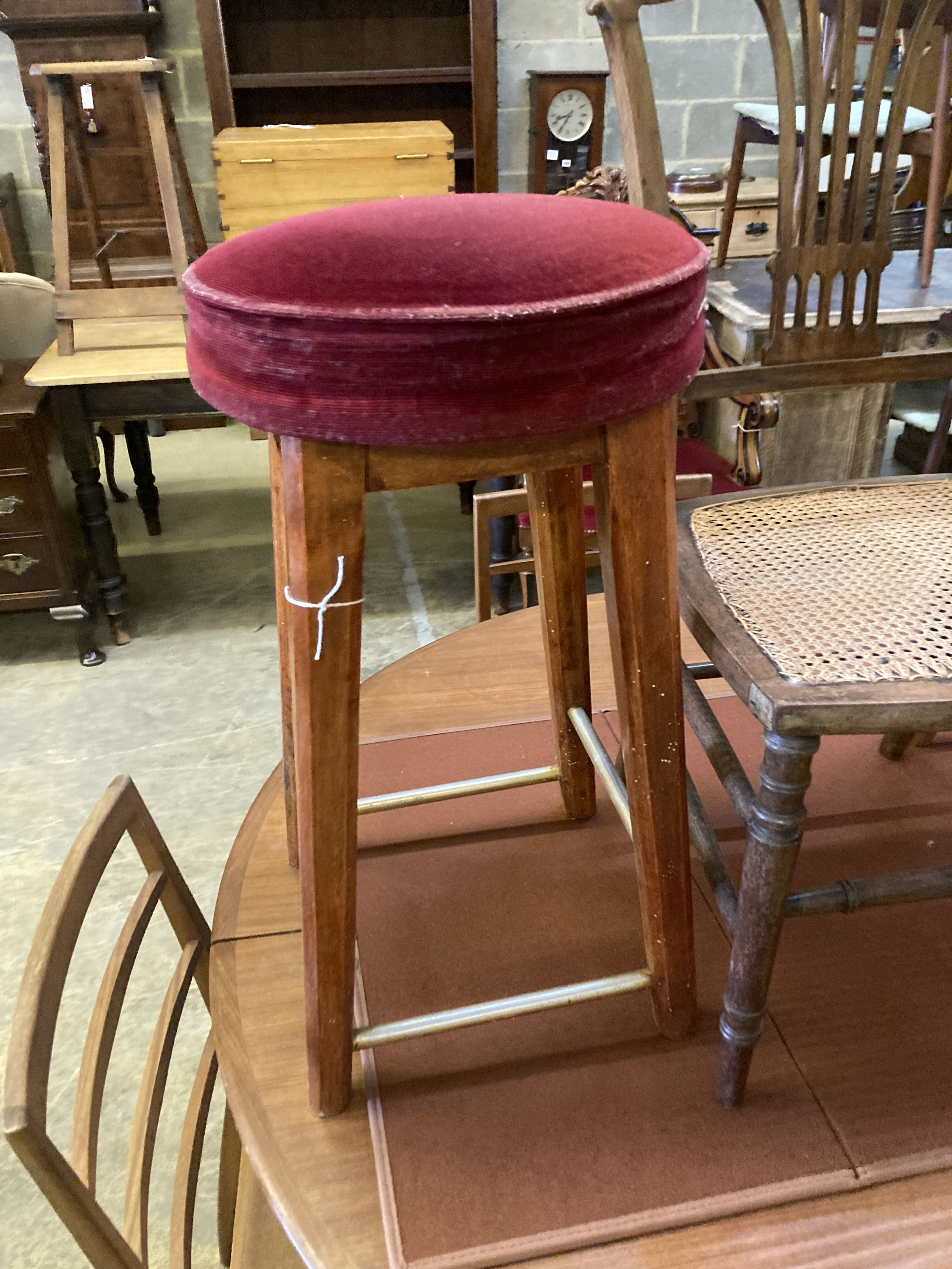 An Edwardian cane seat chair and a pair of beech stools